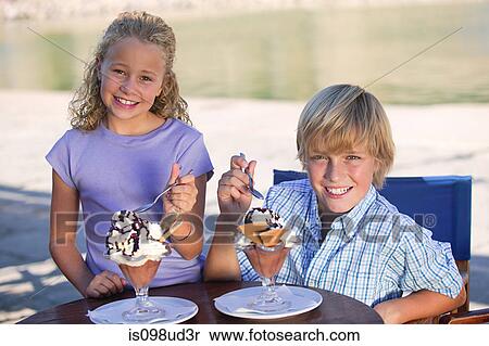 Brother and sister with ice cream sundaes View Large Photo Image Stock Photography - Brother and sister with ice cream sundaes. Fotosearch