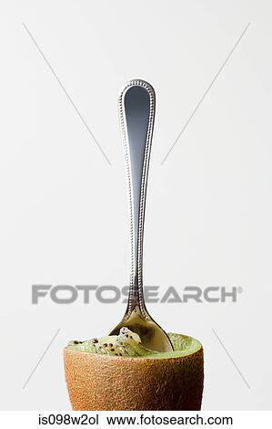 Half eaten kiwi with teaspoon View Large Photo Image Stock Image - Half eaten kiwi with teaspoon. Fotosearch