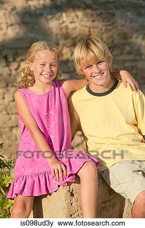 Stock Photo - Happy brother and sister outdoors. Fotosearch