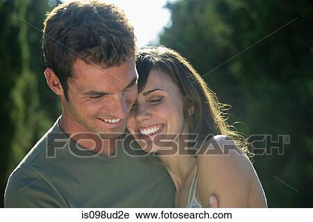 Stock Image - Happy couple outdoors. Fotosearch