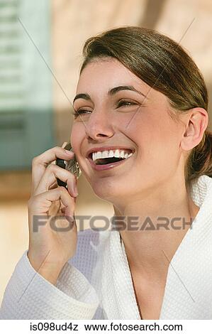 Stock Photo - Happy woman in cellphone. Fotosearch