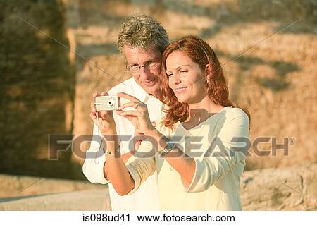 Mature couple looking at camera View Large Photo Image Stock Image - Mature couple looking at camera. Fotosearch