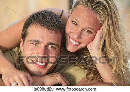 Portrait of a happy young couple View Large Photo Image Stock Photo - Portrait of a happy young couple. Fotosearch