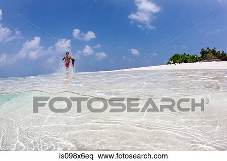 Running in shallow water View Large Photo Image Stock Photography - Running in shallow water. Fotosearch