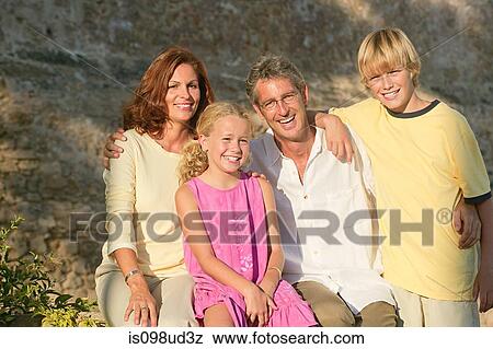 Two generation family outdoors View Large Photo Image Stock Photo - Two generation family outdoors. Fotosearch