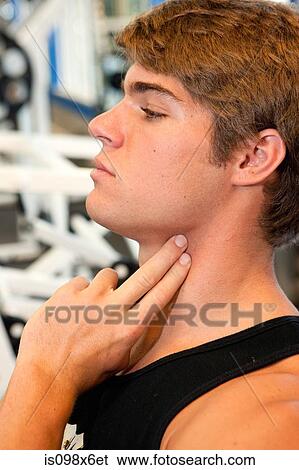 Young man checks heartbeat View Large Photo Image Stock Photograph - Young man checks heartbeat. Fotosearch