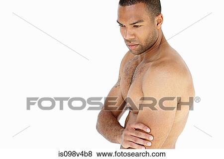 Young man touching arm View Large Photo Image Stock Photo - Young man touching arm. Fotosearch