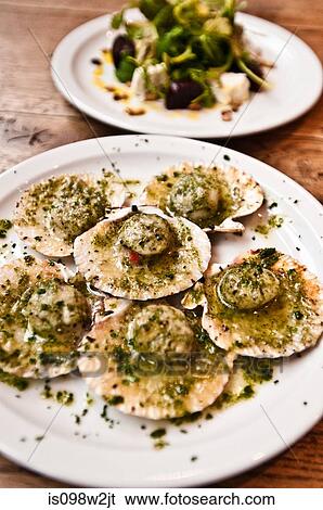 Scallops in pesto in cafe View Large Photo Image Stock Photograph - Scallops in pesto in cafe. Fotosearch