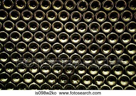 Picture - Stack of wine bottles, full frame. Fotosearch