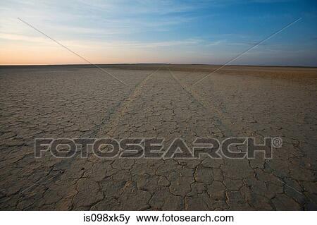 Cracked earth and horizon, Northern Cape, South Africa View Large Photo Image Stock Photo - Cracked earth and horizon, Northern Cape, South Africa. Fotosearch