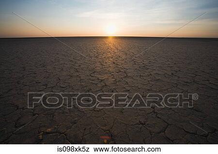 Cracked earth and horizon, Northern Cape, South Africa View Large Photo Image Stock Photo - Cracked earth and horizon, Northern Cape, South Africa. Fotosearch
