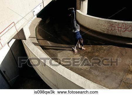 Stock Image - Person doing handstand. Fotosearch
