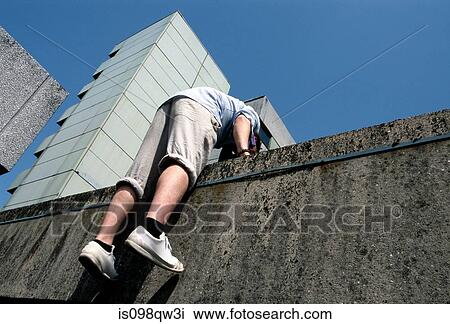Person going over wall View Large Photo Image Stock Image - Person going over wall. Fotosearch