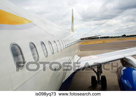 Airplane on runway View Large Photo Image Stock Image - Airplane on runway. Fotosearch