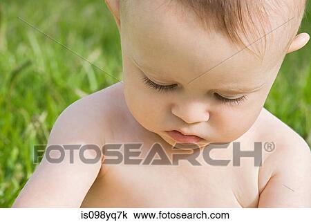 Stock Image - Baby boy outdoors. Fotosearch