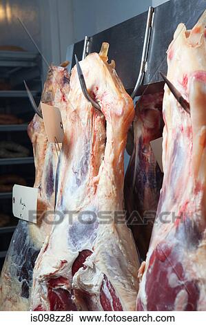 Beef hanging from meat hooks View Large Photo Image Stock Image - Beef hanging from meat hooks. Fotosearch