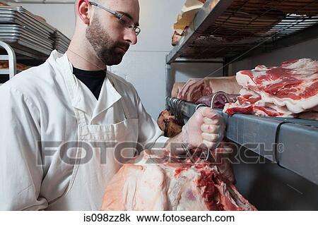 Butcher hanging meat View Large Photo Image Stock Image - Butcher hanging meat. Fotosearch