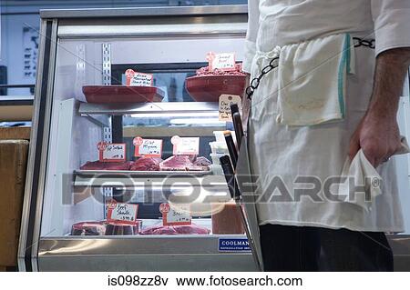 Butcher in shop View Large Photo Image Stock Photo - Butcher in shop. Fotosearch
