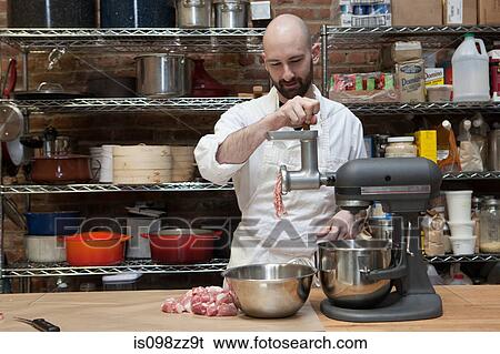 Butcher making ground meat View Large Photo Image Stock Photograph - Butcher making ground meat. Fotosearch