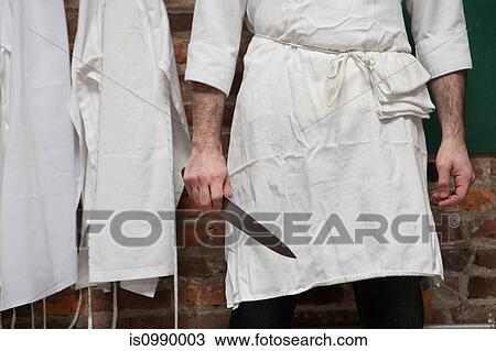 Butcher with knife View Large Photo Image Stock Image - Butcher with knife. Fotosearch