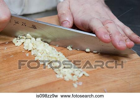 Chef adding dicing onions View Large Photo Image Stock Photo - Chef adding dicing onions. Fotosearch