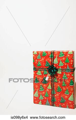 Picture - Christmas present against white background. Fotosearch