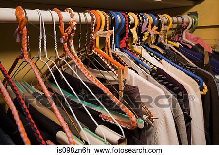 Stock Image - Clothes on hangers. Fotosearch
