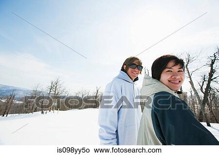 Couple wearing smiling to camera View Large Photo Image Picture - Couple wearing smiling to camera. Fotosearch