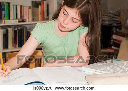 Stock Photograph - Girl doing homework. Fotosearch