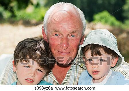 Grandfather with two grandsons, portrait View Large Photo Image Stock Image - Grandfather with two grandsons, portrait. Fotosearch