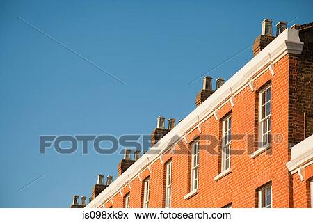 House exteriors against blue sky View Large Photo Image Stock Photo - House exteriors against blue sky. Fotosearch