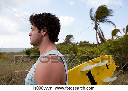 Kitesurfer looking out to sea View Large Photo Image Picture - Kitesurfer looking out to sea. Fotosearch