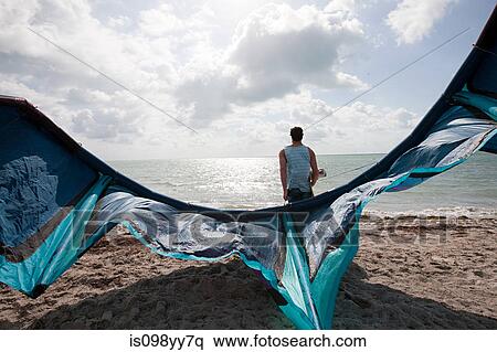Stock Photography - Kitesurfer on beach. Fotosearch