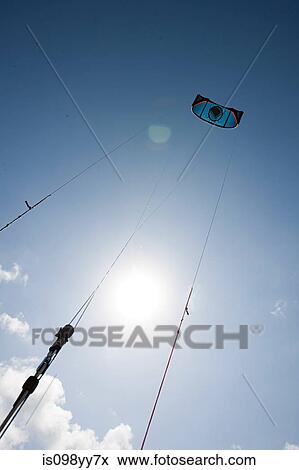 Stock Photo - Kitesurfing, low angle view. Fotosearch