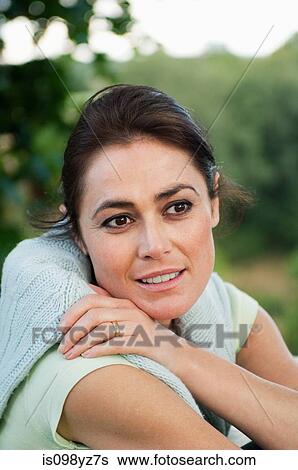 Mid adult woman looking away, portrait View Large Photo Image Stock Photograph - Mid adult woman looking away, portrait. Fotosearch