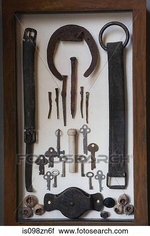 Old iron objects in display cabinet View Large Photo Image Stock Image - Old iron objects in display cabinet. Fotosearch