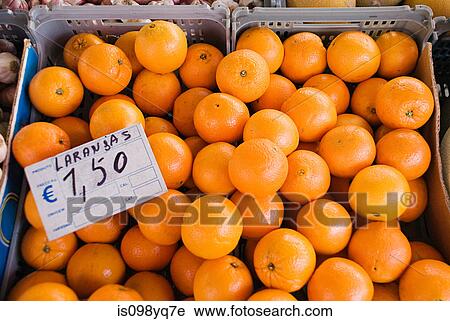 Stock Image - Oranges on fruit stall. Fotosearch