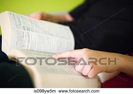 Person reading dictionary View Large Photo Image Picture - Person reading dictionary. Fotosearch