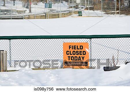 Stock Photograph - Playing field in snow with closed sign. Fotosearch