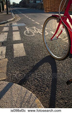 Stock Image - Road with cycle path and bicycle. Fotosearch