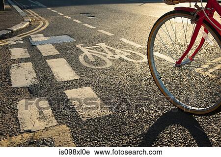 Road with cycle path and bicycle View Large Photo Image Stock Image - Road with cycle path and bicycle. Fotosearch