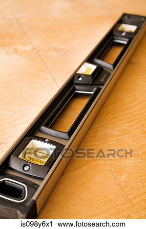 Spirit level and plywood View Large Photo Image Stock Image - Spirit level and plywood. Fotosearch