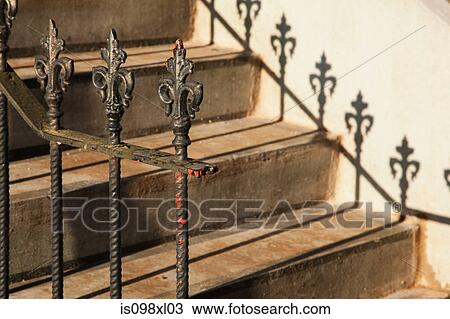 Stock Image - Steps and wrought iron railings. Fotosearch