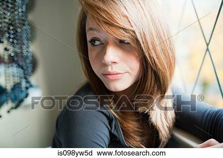 Teenage girl by bedroom window View Large Photo Image Stock Image - Teenage girl by bedroom window. Fotosearch