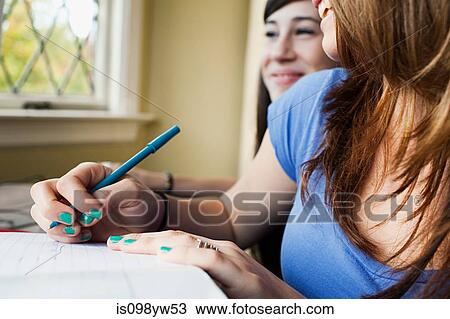 Teenage girls doing homework View Large Photo Image Stock Image - Teenage girls doing homework. Fotosearch