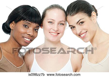 Stock Image - Three young women smiling. Fotosearch