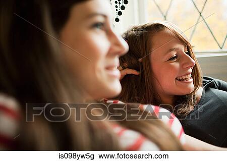 Two teenage girls talking View Large Photo Image Stock Image - Two teenage girls talking. Fotosearch