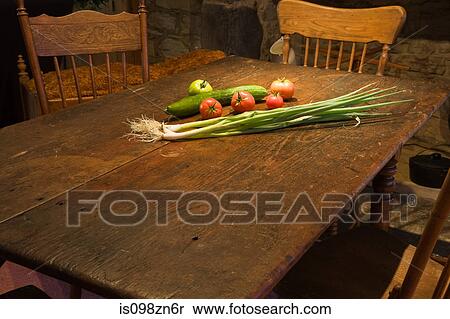 Stock Photography - Vegetables on rustic kitchen table. Fotosearch
