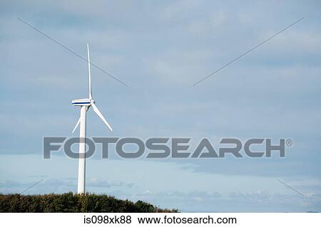 Wind turbine against blue sky View Large Photo Image Stock Photo - Wind turbine against blue sky. Fotosearch