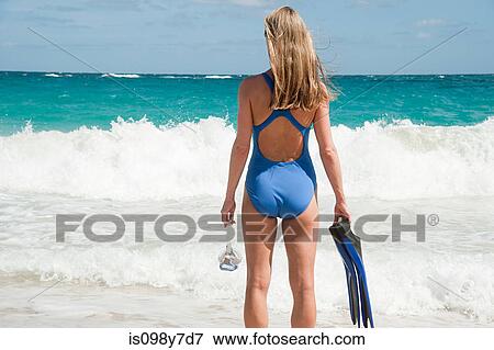 Woman at water's edge, Mustique, Grenadine Islands View Large Photo Image Stock Photo - Woman at water's edge, Mustique, Grenadine Islands. Fotosearch